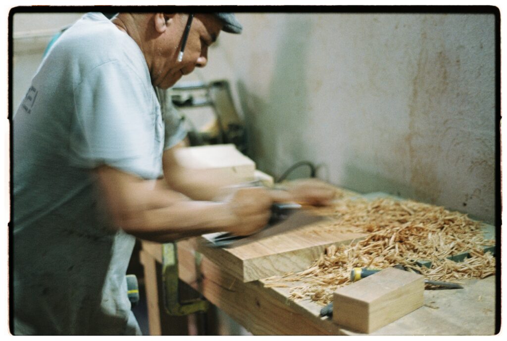 Gola artisans handcrafting concrete and wood furniture for upscale interior design projects.