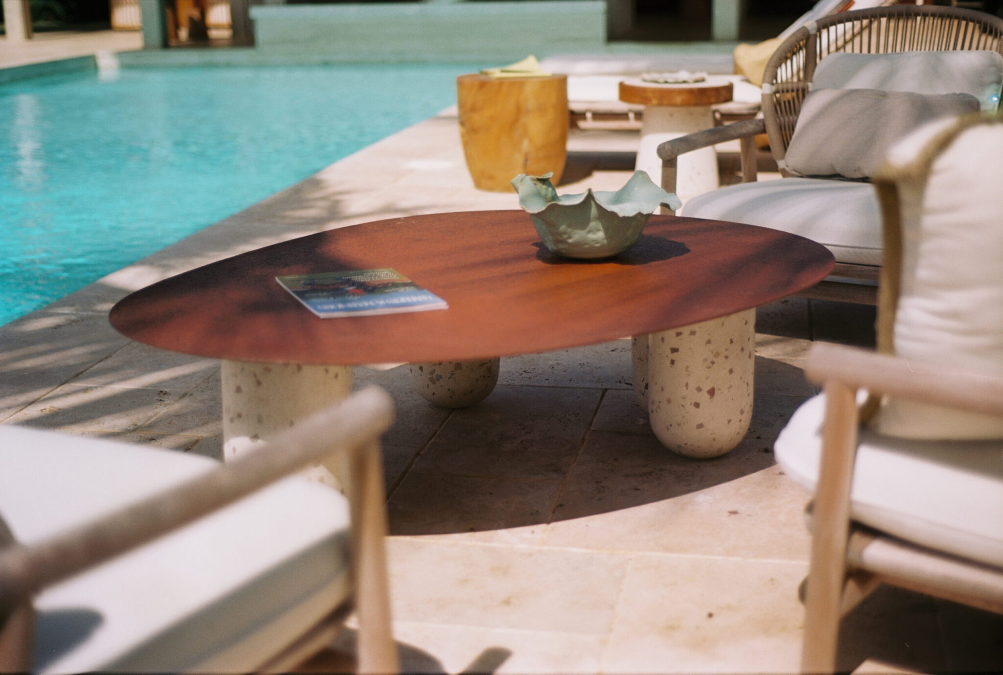 Buque organic terrazzo concrete coffee table with rusted metal top and asymmetrical base