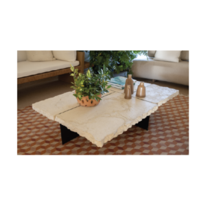 Raw white concrete coffee table with rock-like unpolished edges, separated slab top, and thin black iron base