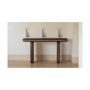 Medianoche console table made by Gola in the Dominican Republic, crafted from wood with integrated concrete elements and rounded legs and surface.