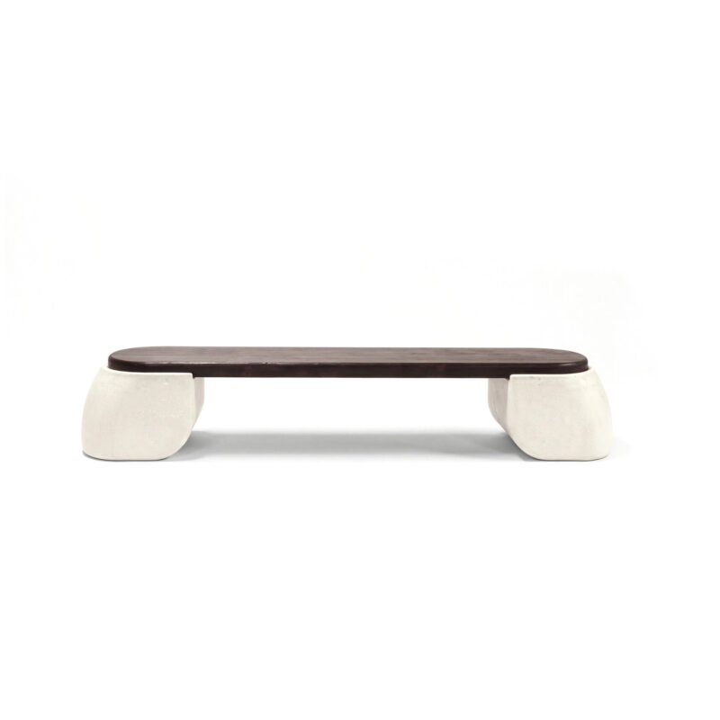 Bao bench with two half-round concrete legs supporting an oval burnt wood seat, high-end modern bench in neutral tones.