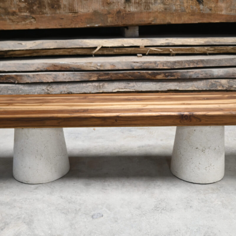 C1 Bench by Gola Home, modern concrete furniture from the Dominican Republic featuring two white concrete cone bases supporting a teak wood seat.