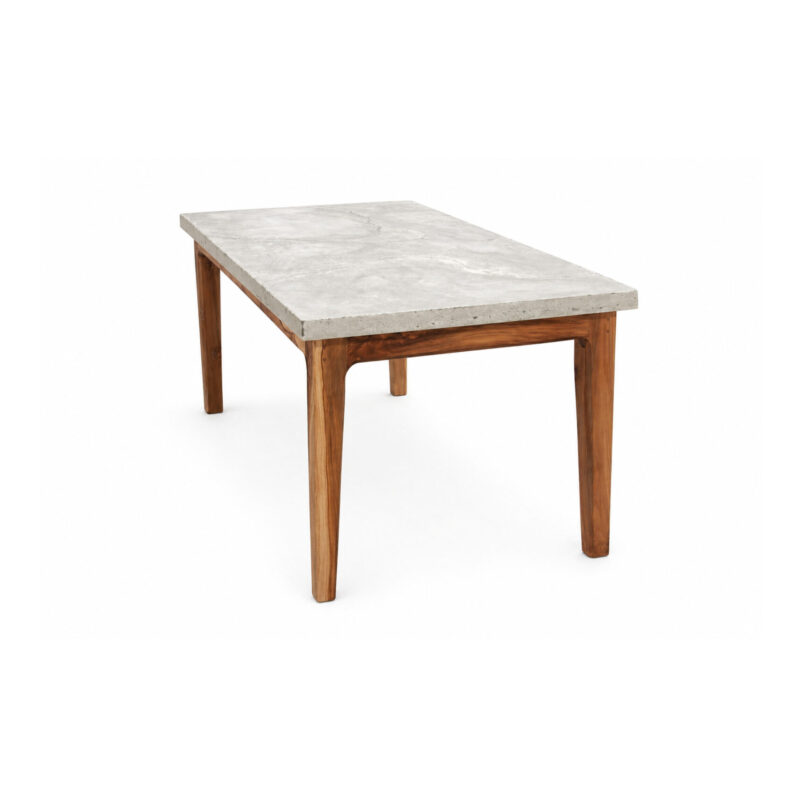 The W Dining Table by Gola Home reinterprets the classic dining table silhouette through material contrast and refined craftsmanship. A rectangular concrete top rests on four solid wooden legs, creating a balanced composition that blends strength and warmth. Handcrafted in the Dominican Republic, this modern concrete and wood dining table is designed for residential and hospitality interiors seeking timeless design, durability, and understated elegance.