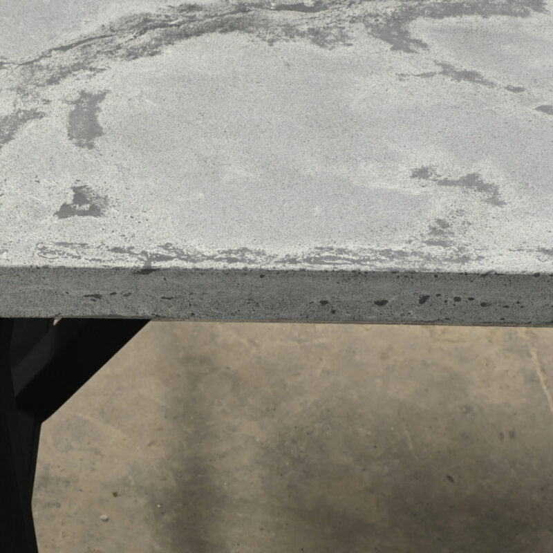 Flotante desk in white veined concrete with concealed black metal structure and solid wood base, modern architectural furniture by Gola Home, handcrafted in the Dominican Republic.