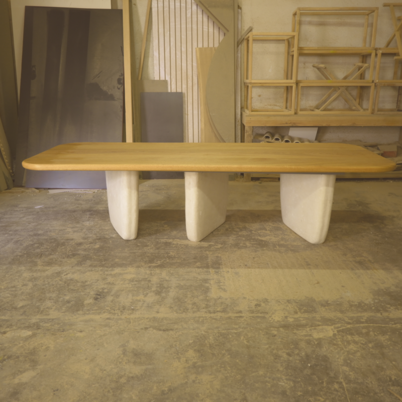 Rectangular Dining Table PA by Gola Home, modern concrete furniture from the Dominican Republic with a natural wood top supported by three white concrete bases positioned asymmetrically.