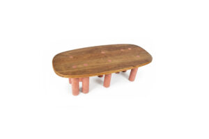 Pilares dining table with solid oak tabletop featuring terracotta concrete circular inlays aligned with eight supporting pillars, artisan Caribbean dining table for 6 to 8 people.