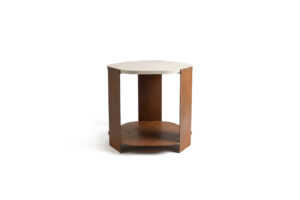 Ferro side table with hexagonal oxidized metal base in a bronze-orange tone and a beige concrete top with dark veining, sculptural statement table measuring 66 x 61 x 61 cm.