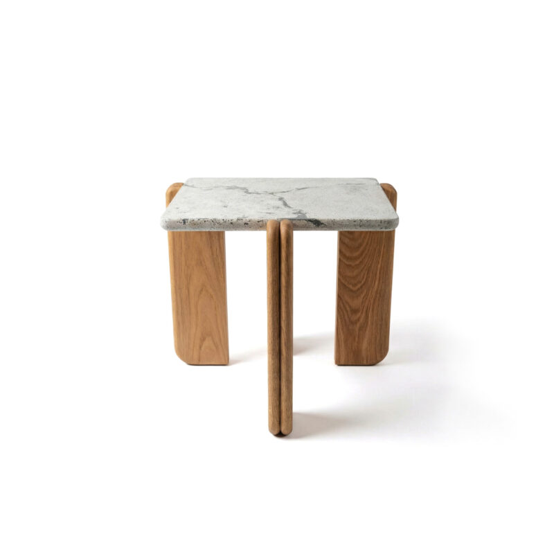 Peninsula side table measuring 61 x 61 x 61 cm with a white concrete top featuring subtle slate-toned veining, supported by three solid rosewood pillars.