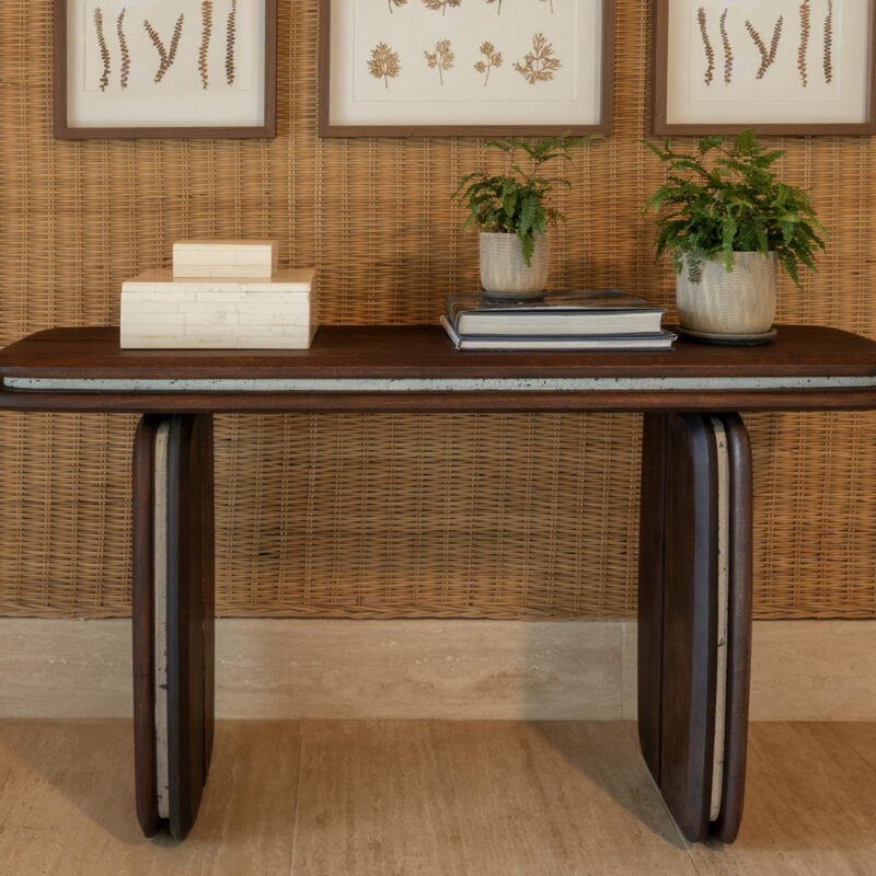 medianoche console table made by Gola in the Dominican Republic, crafted from wood with integrated concrete elements and rounded legs and surface.