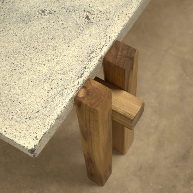 Japandi style coffee table with concrete top and solid wood frame, featuring lower slatted shelf, handcrafted by Gola Home in the Dominican Republic.