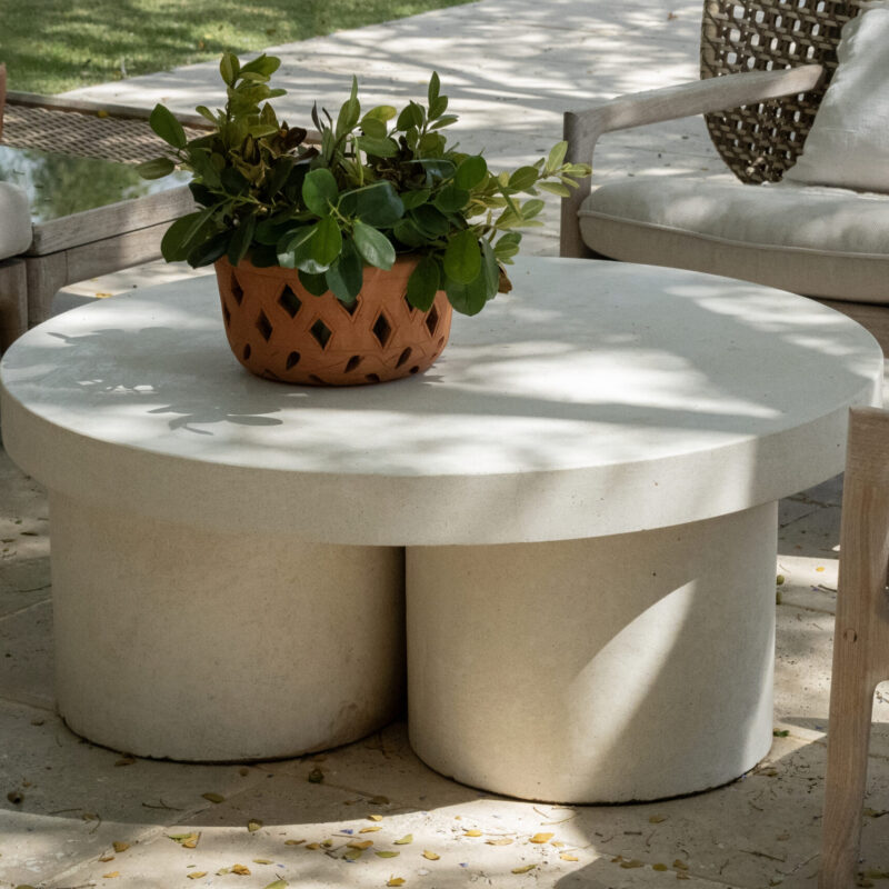 Robust round and square concrete top coffee table with cylindrical concrete pillar bases, modern and durable outdoor design.