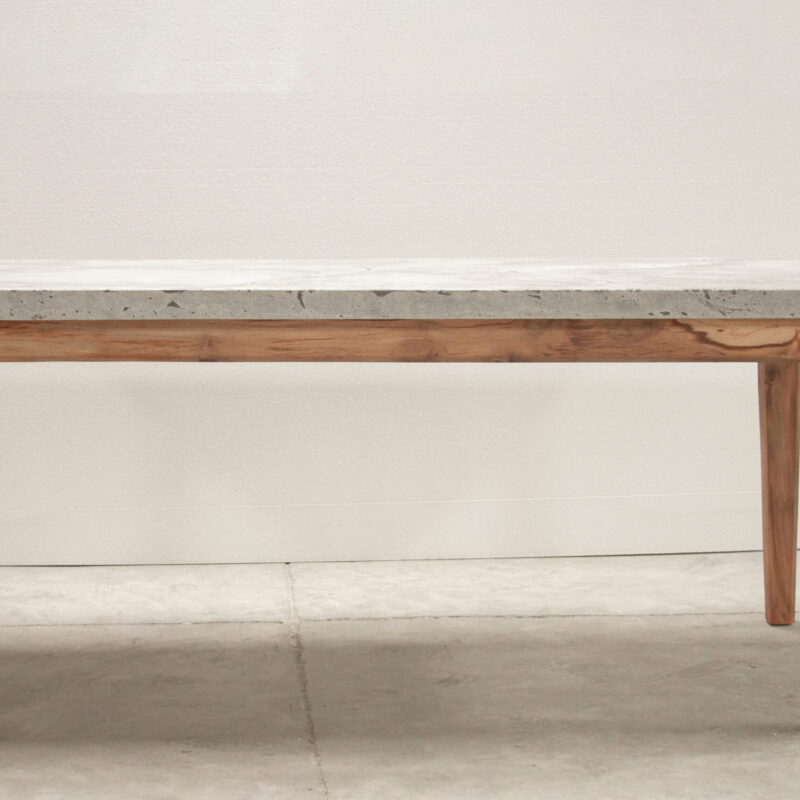 W Dining Table by Gola Home with rectangular concrete top and four solid wooden legs, modern handcrafted dining furniture made in the Dominican Republic.