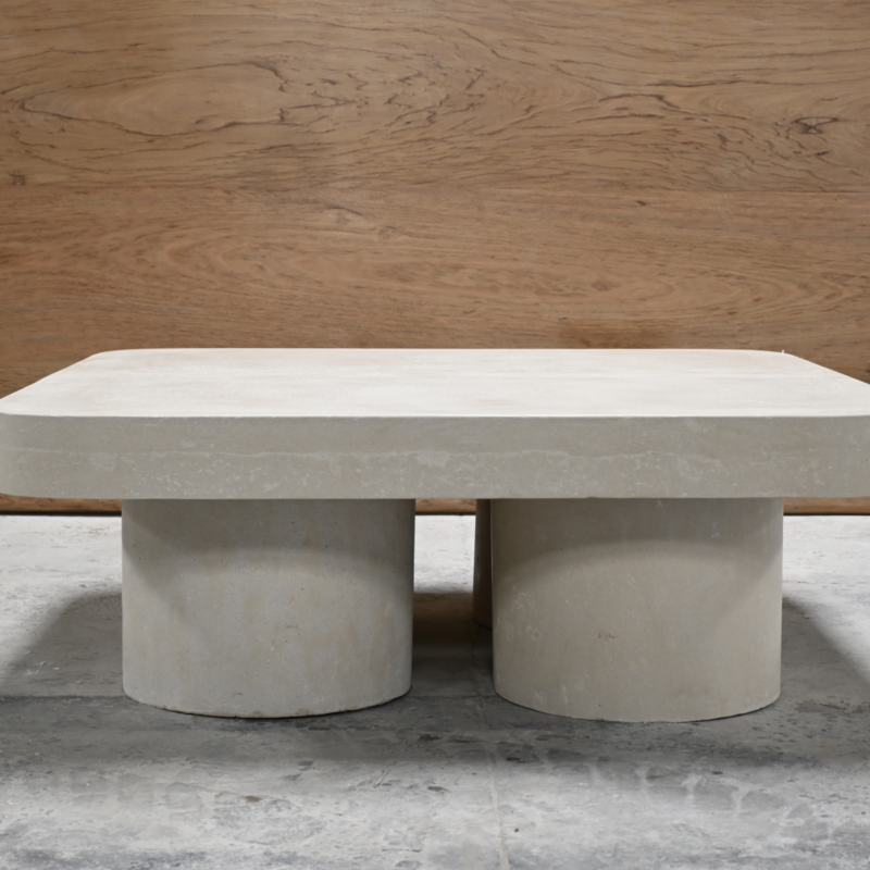Robust round and square concrete top coffee table with cylindrical concrete pillar bases, modern and durable outdoor design.