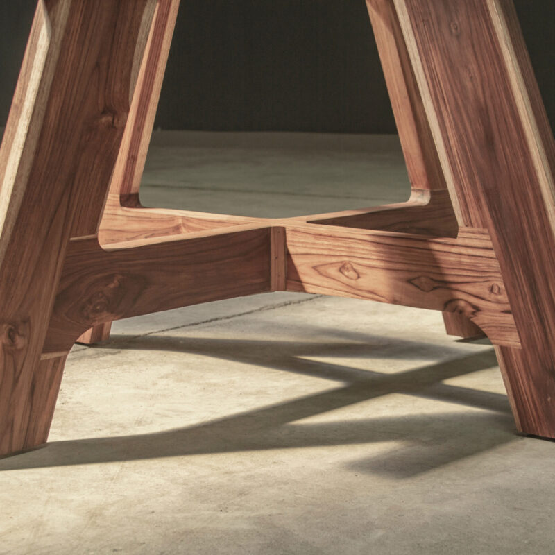 Dining Table A by Gola Home, classic concrete furniture from the Dominican Republic with polished round concrete top and double-A teak wood base.
